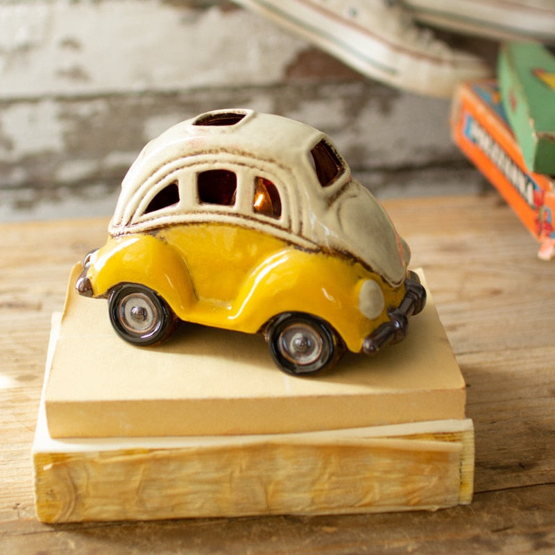 yellow V W bug car shaped night light set on a stack of books
