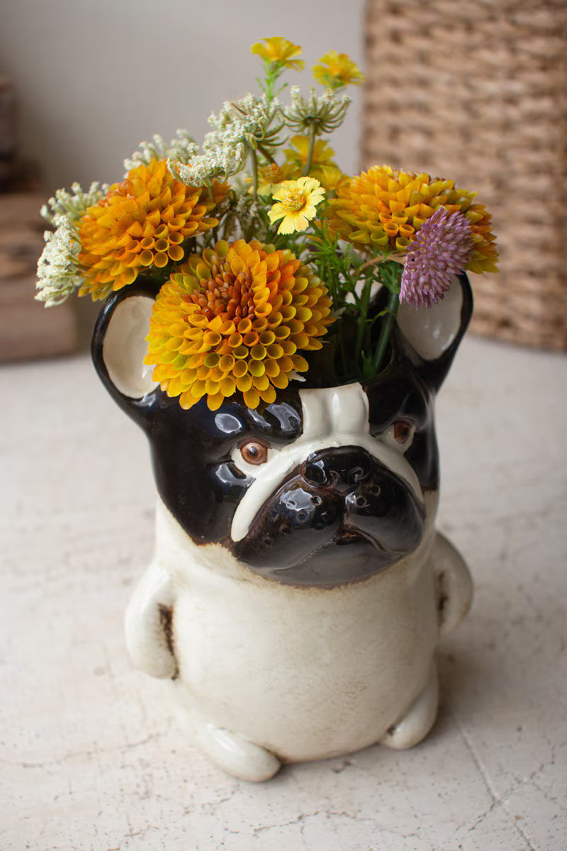 angled top view of Ceramic French Bulldog Planter filled with orange flowers
