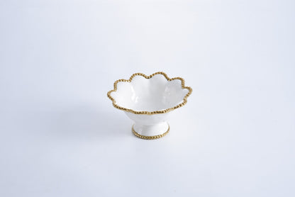 white Footed Bowl with gold beaded rim on a white background
