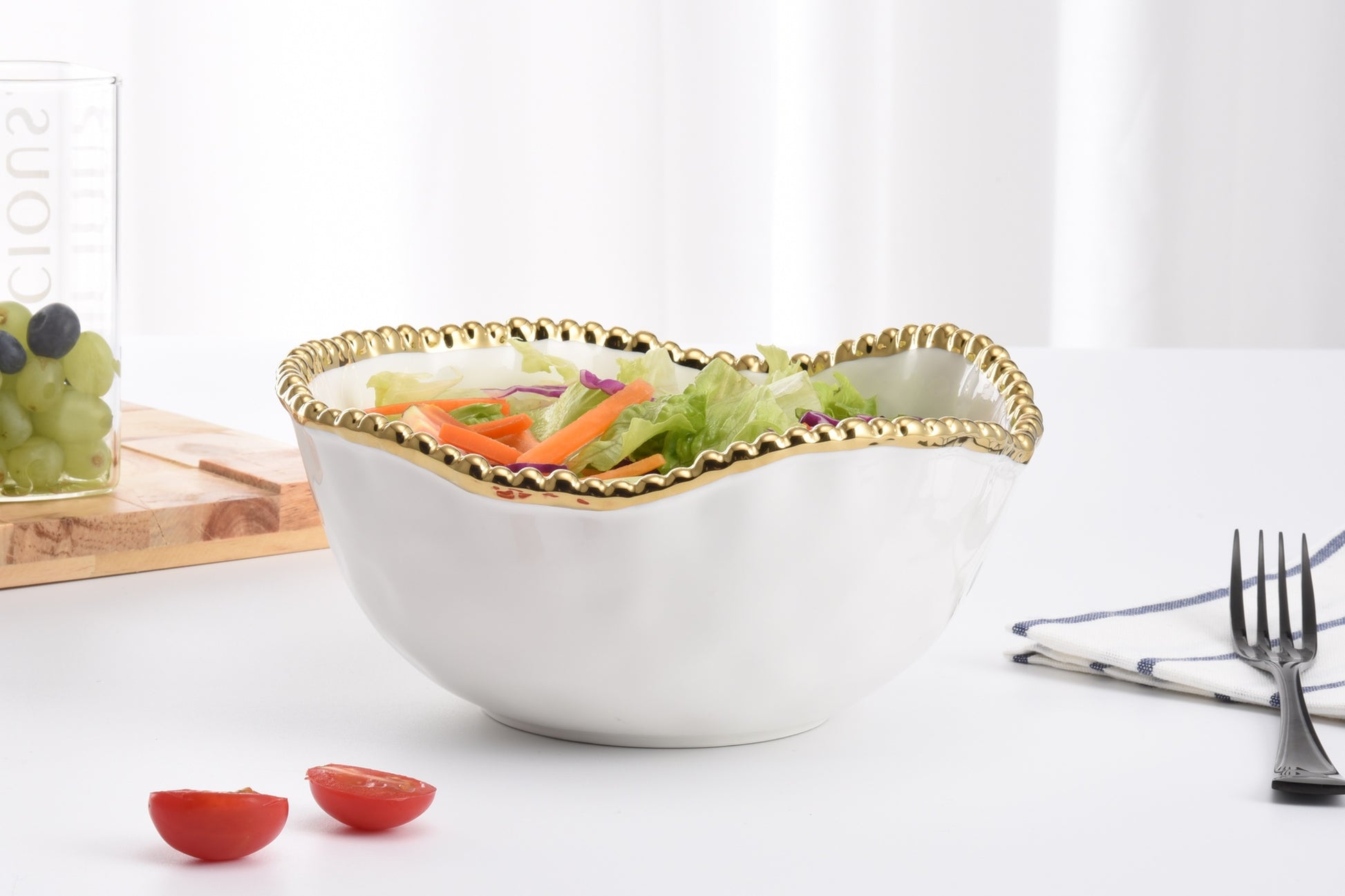 Golden Salerno Oversized Serving Bowl with salad in it
