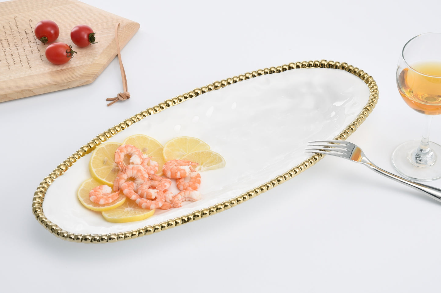 white oval serving piece with food in it
