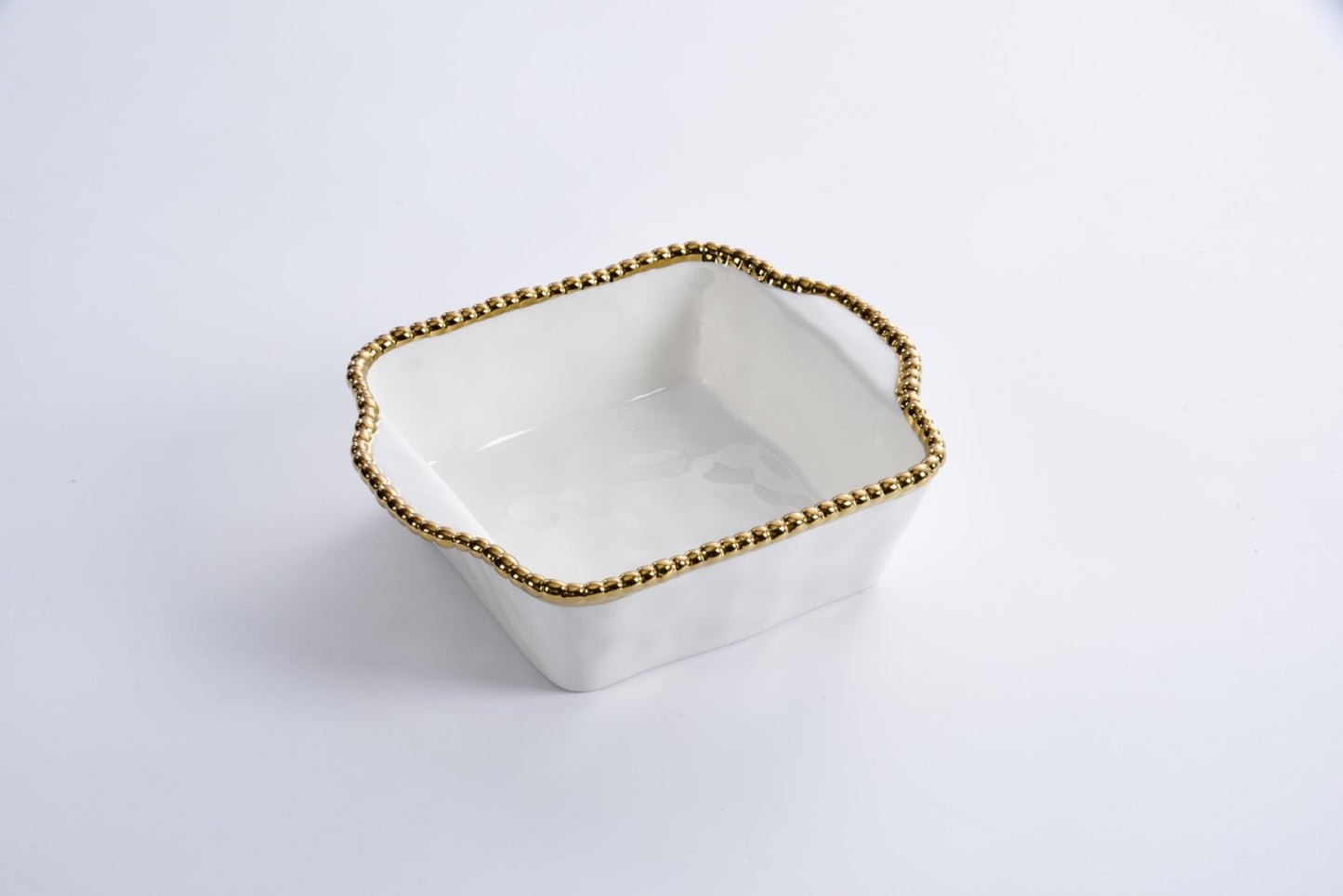 white Baking Dish with gold beaded rim shown on a white background
