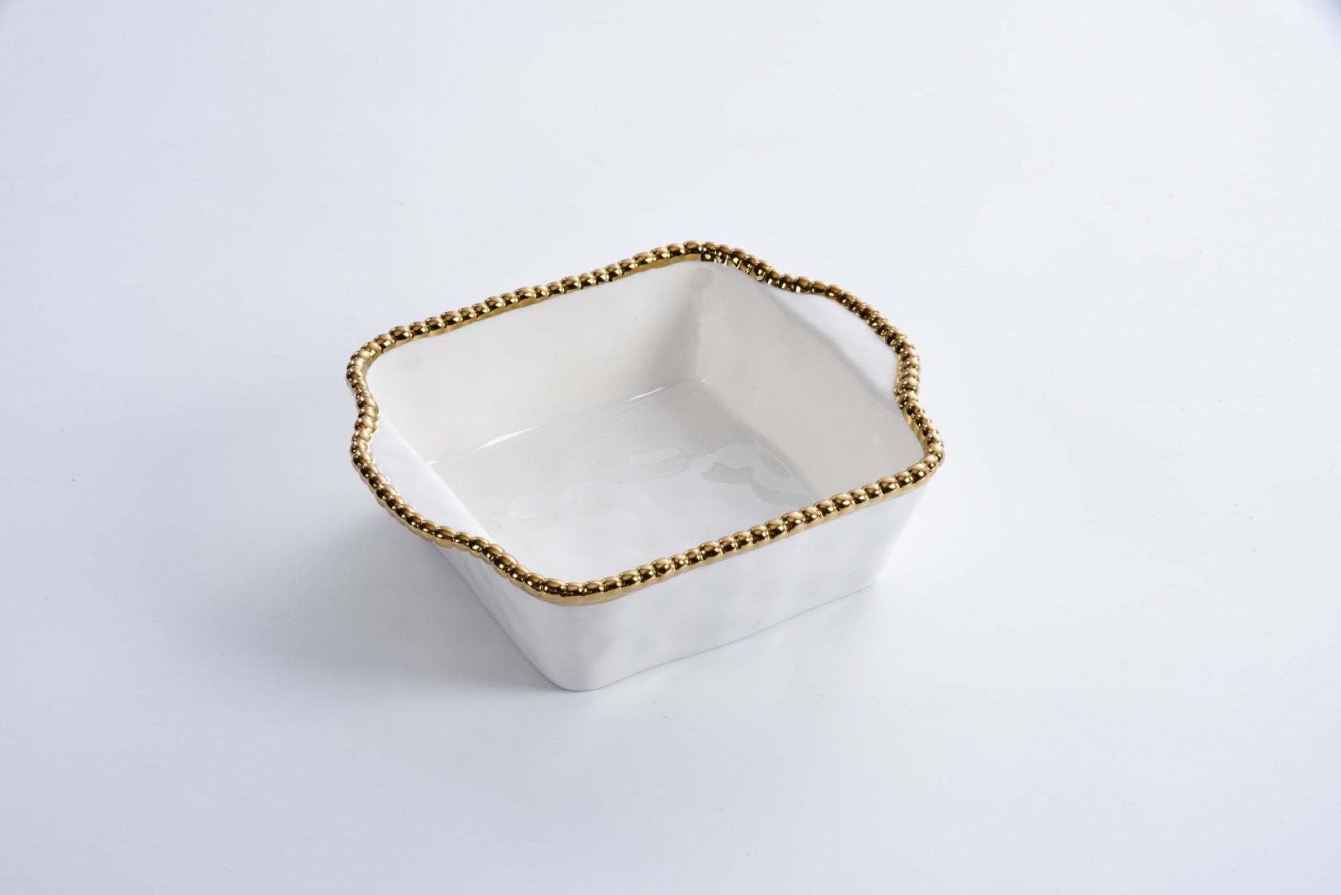 white Baking Dish with gold beaded rim shown on a white background
