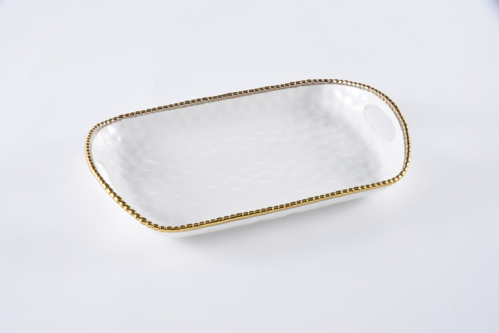 white Rectangular Tray with gold beaded rim and Handles on a white background
