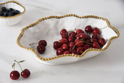 Golden Salerno Serving Bowl with cherries in it
