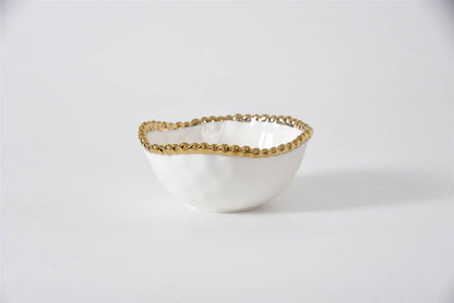 white snack bowl with golden beading around the rim on a white background