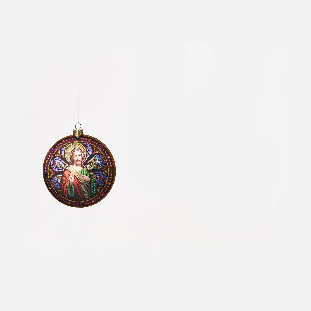 round disc ornament with image of jesus in it