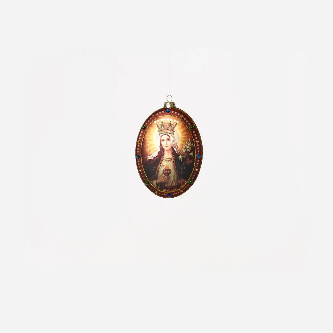 oval glass ornament with image of mary on it