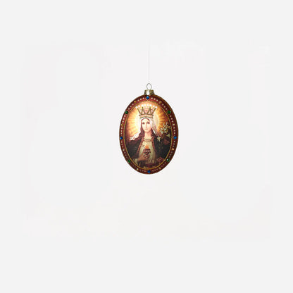 oval glass ornament with image of mary on it