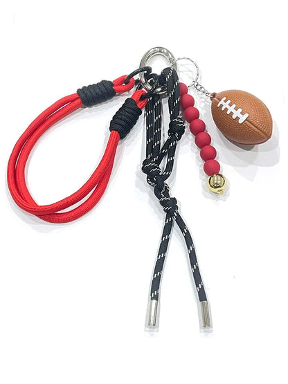 red football bag charm shown on a white background
