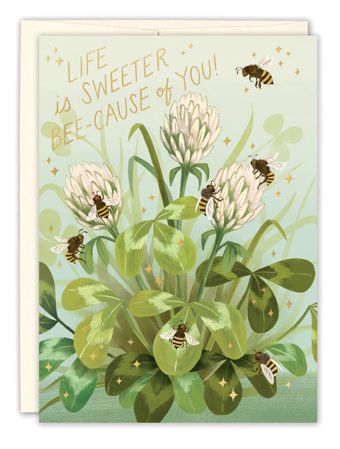 front of card has illustration of growing flowers surrounded by bees, gold text listed in the description, white envelope behind it and displayed on a white background