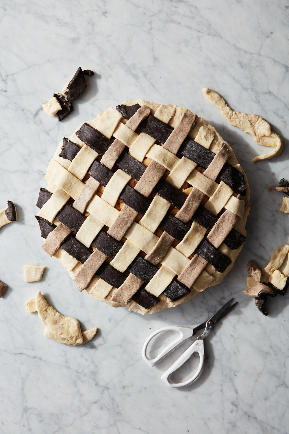 pie with lattice topping on countertop.