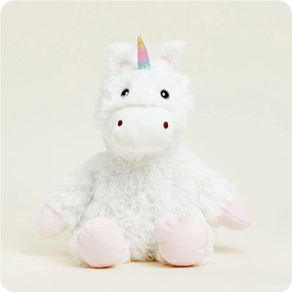 white unicorn with rainbow horn stuffed animal seated on a white background.