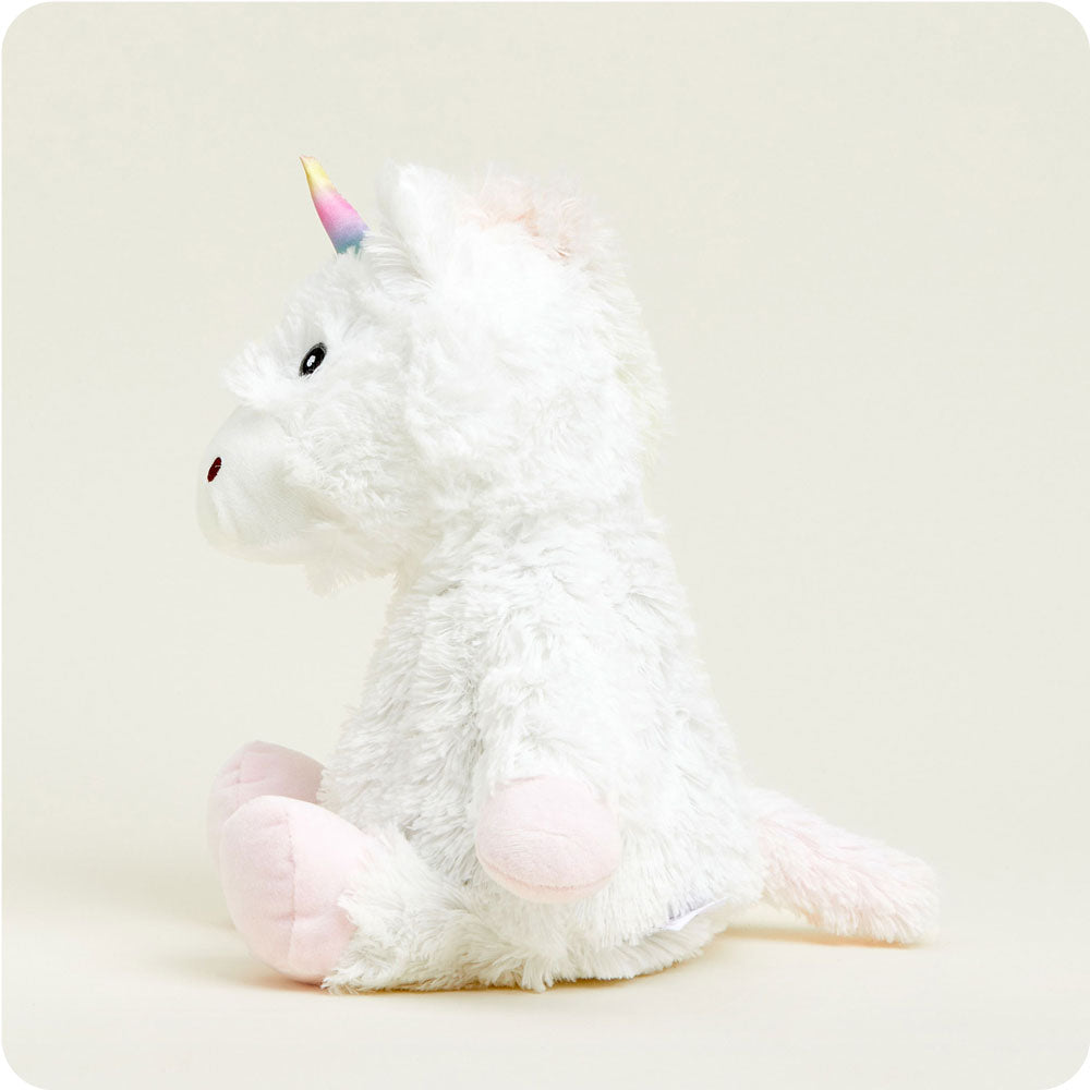 side view of white unicorn plush toy