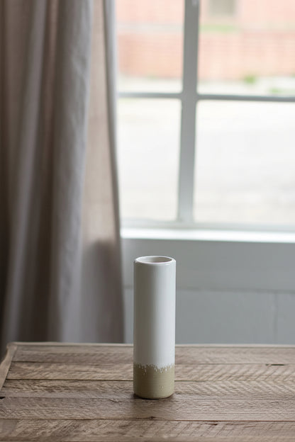small Ceramic Cylinder Bud Vase set on a wooden table