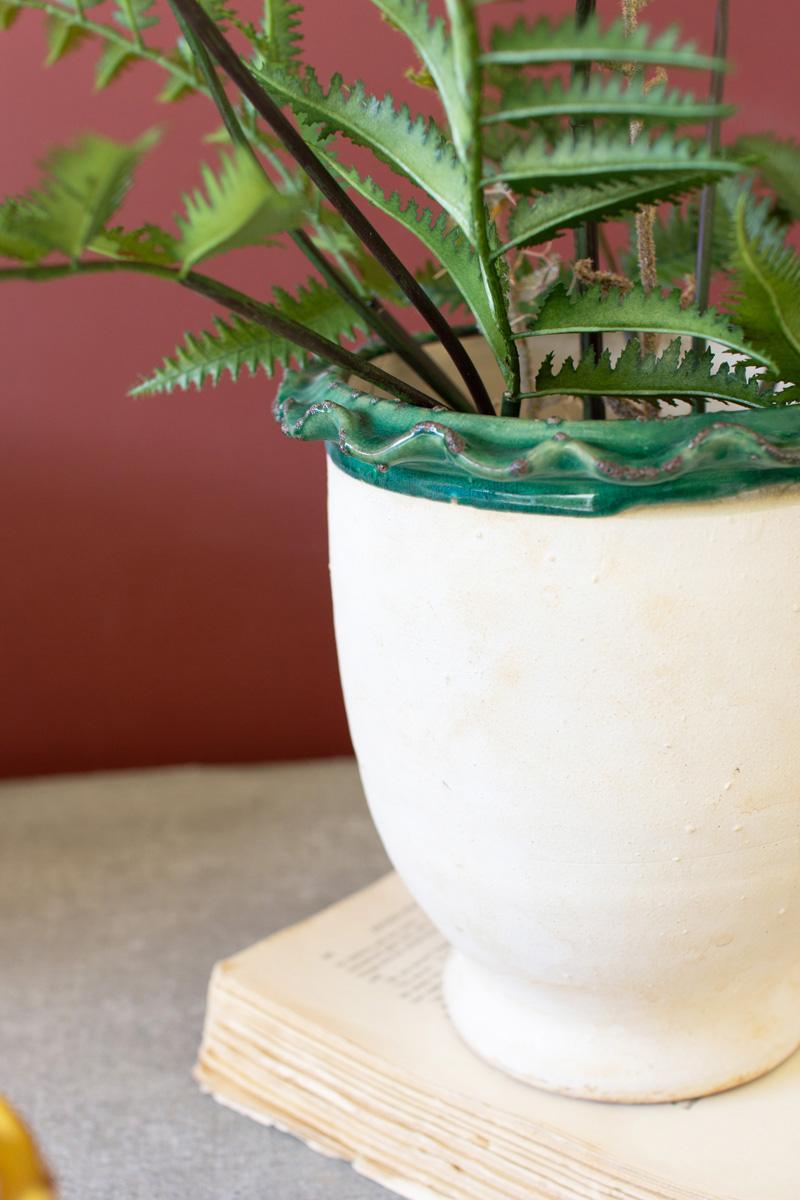 close-p of green ruffled rim pot