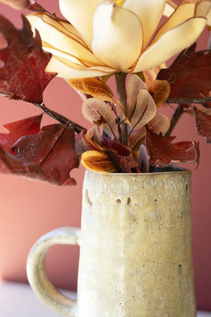 close-up of top of tall pitcher vase