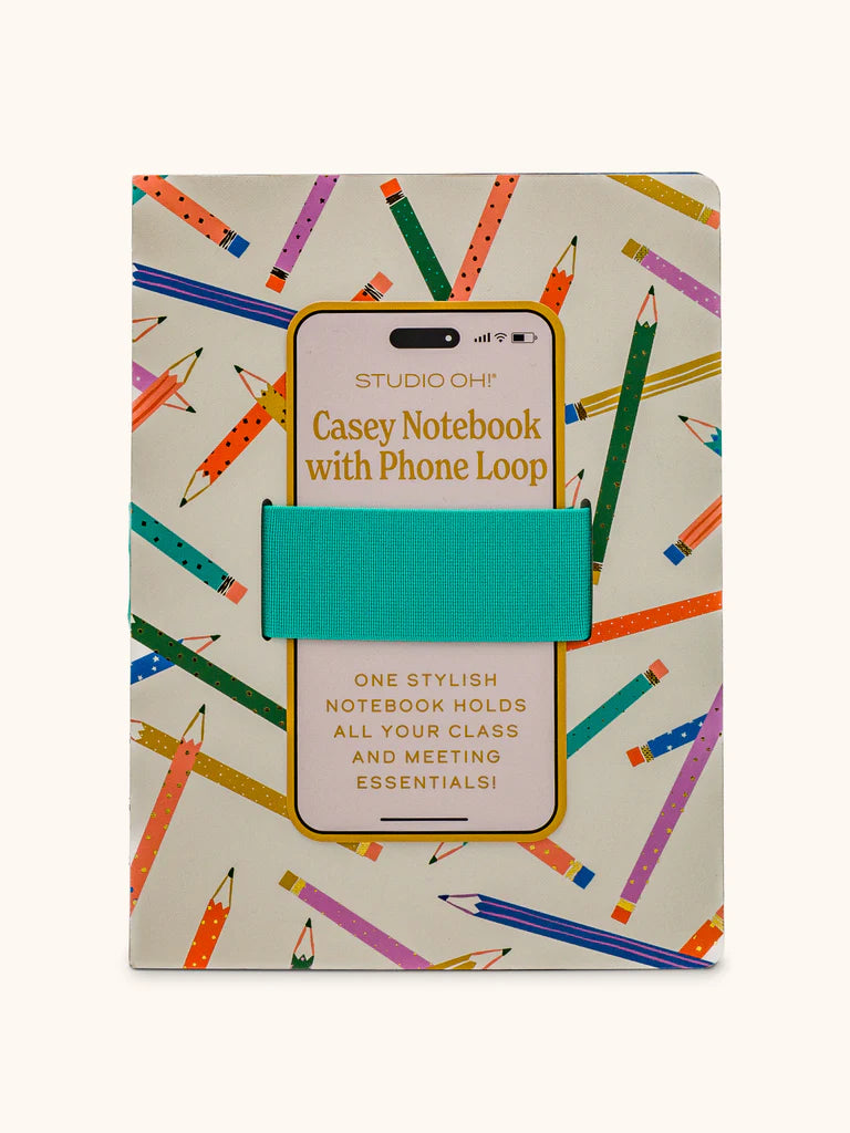 white notebook with all-over colorful pencil design and a teal elastic band for phone.