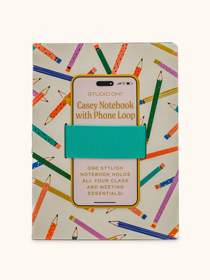 white notebook with all-over colorful pencil design and a teal elastic band for phone.