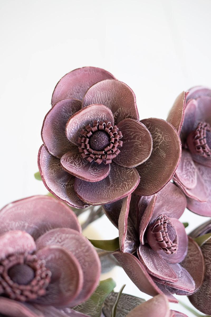 close-up of plum colored artificial flowers.