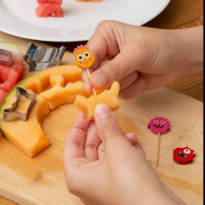 hands assembling Monster Fruit Picks