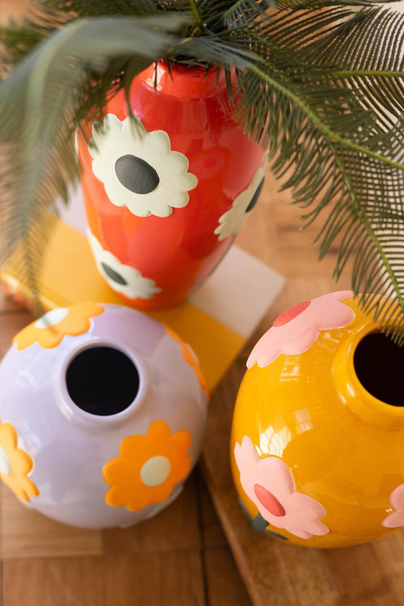 top view of Three colorful vases with floral designs