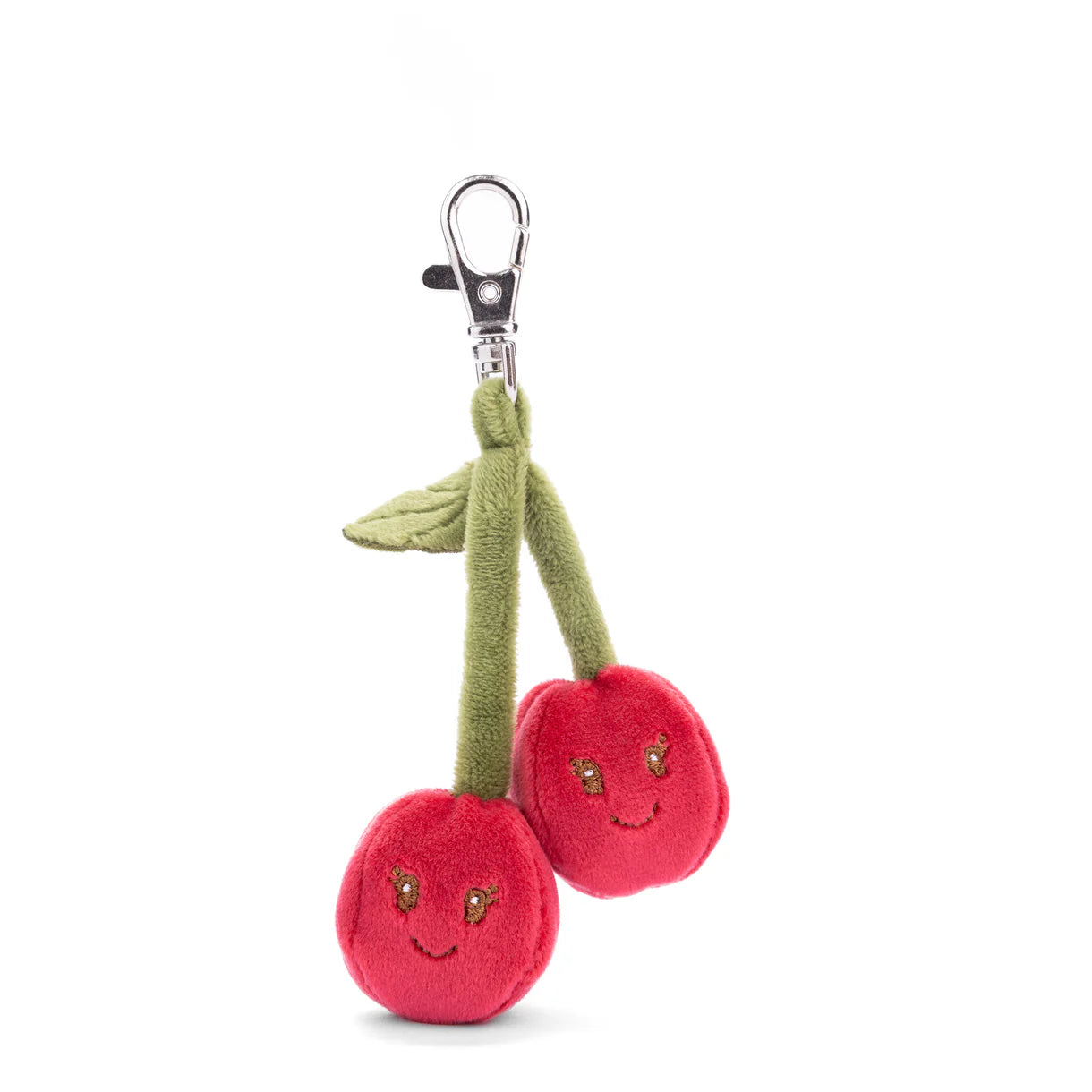 smiling plush cherry bag charm shown on a white background