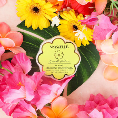 Spongelle product surrounded by colorful flowers