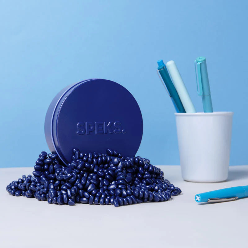 pile of indigo crags arranged on a desk with a pencil holder