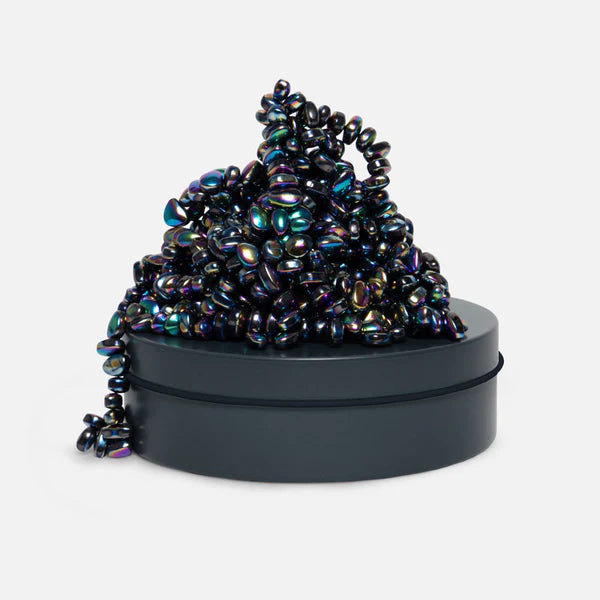 oil slick shiny crags on top of a matching tin
