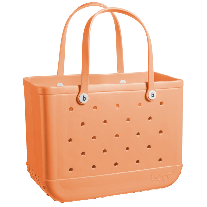 orange bogg bag on white background.