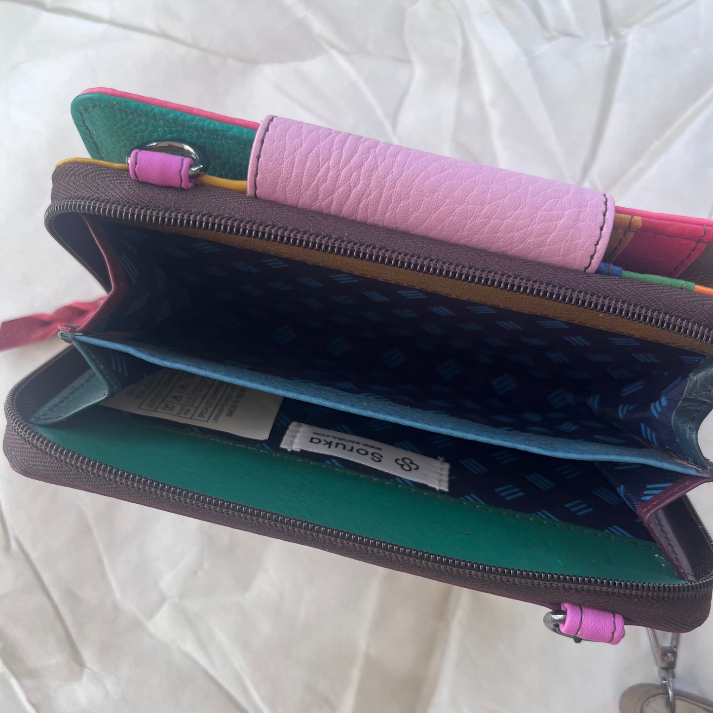 interior view of zippered compartment of pink Beatrice Clutch