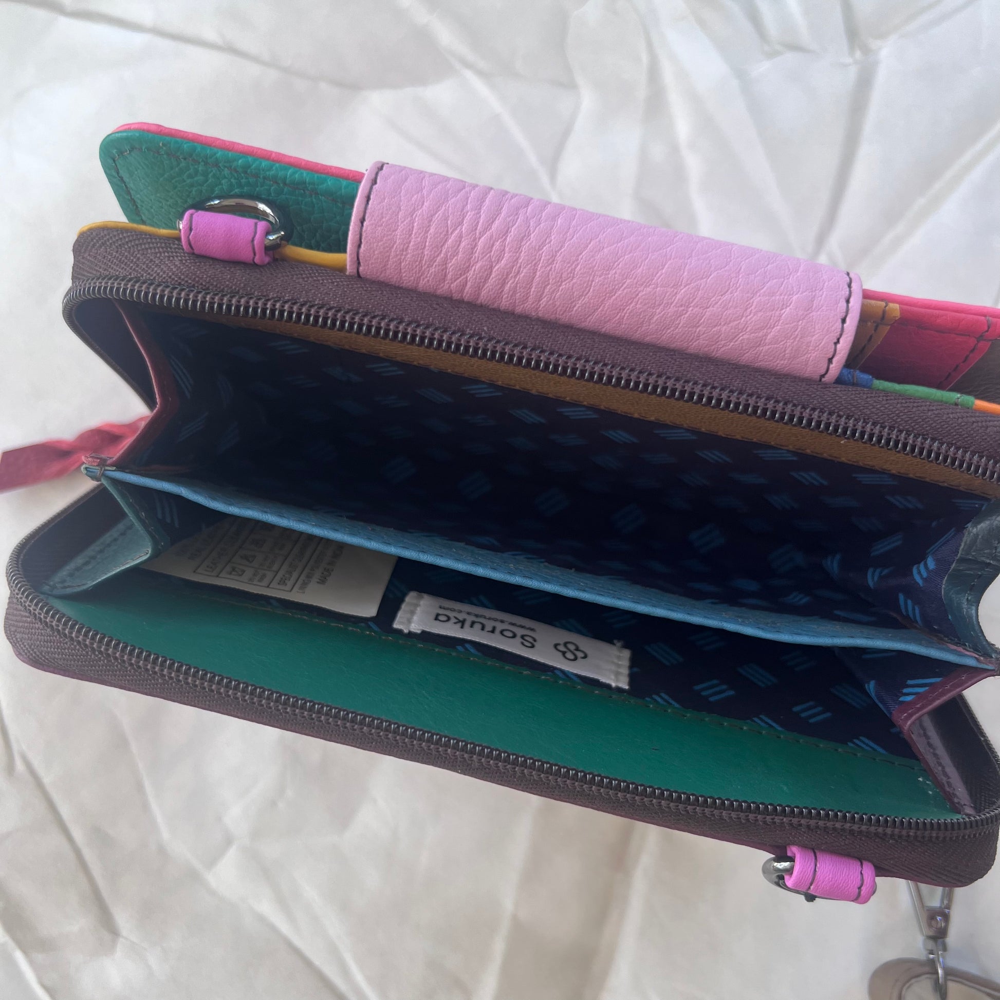 interior view of zippered compartment of pink Beatrice Clutch