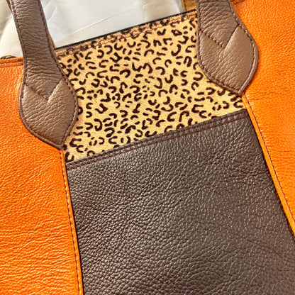 close-up of camel giselle tote.