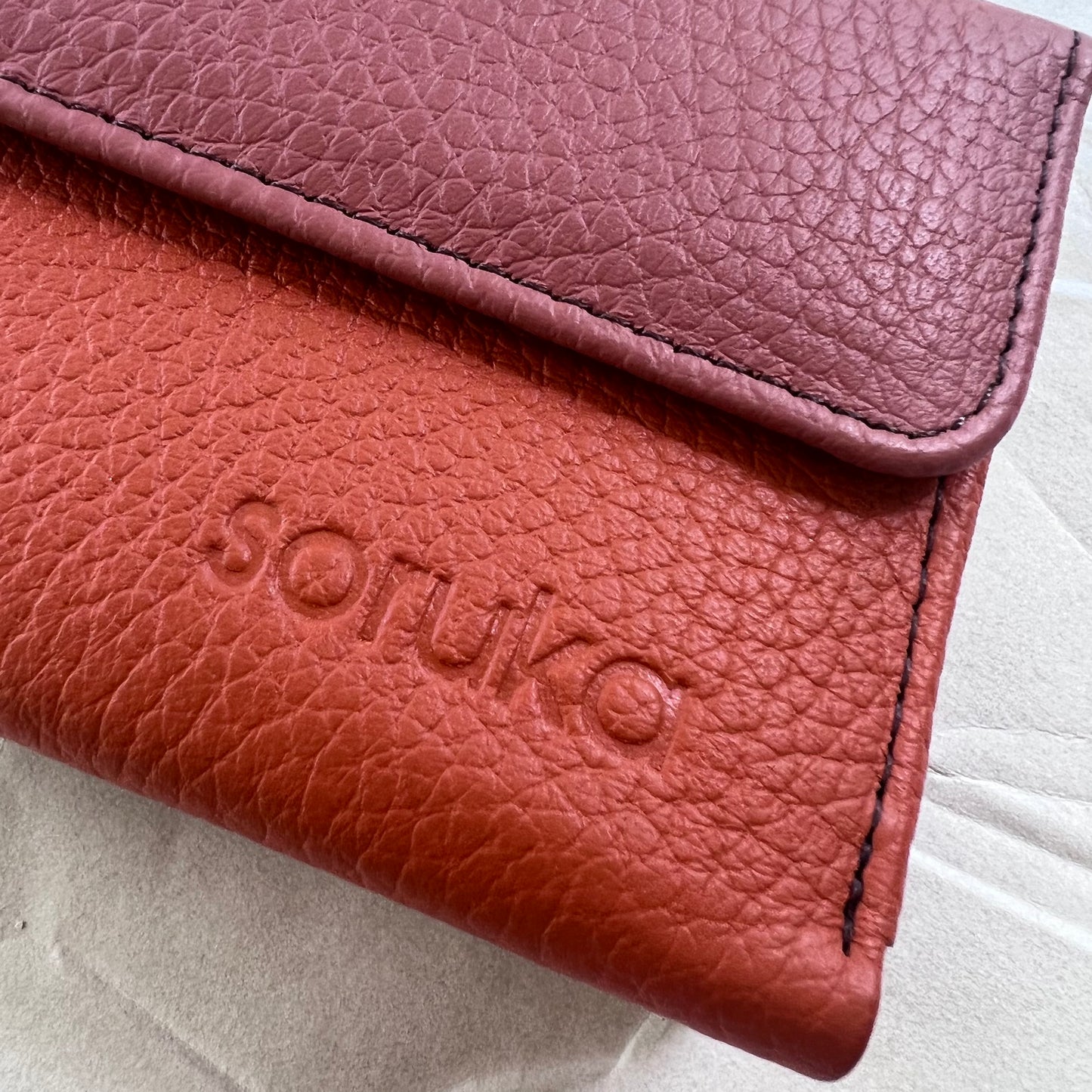 close-up of sunset rings wallet