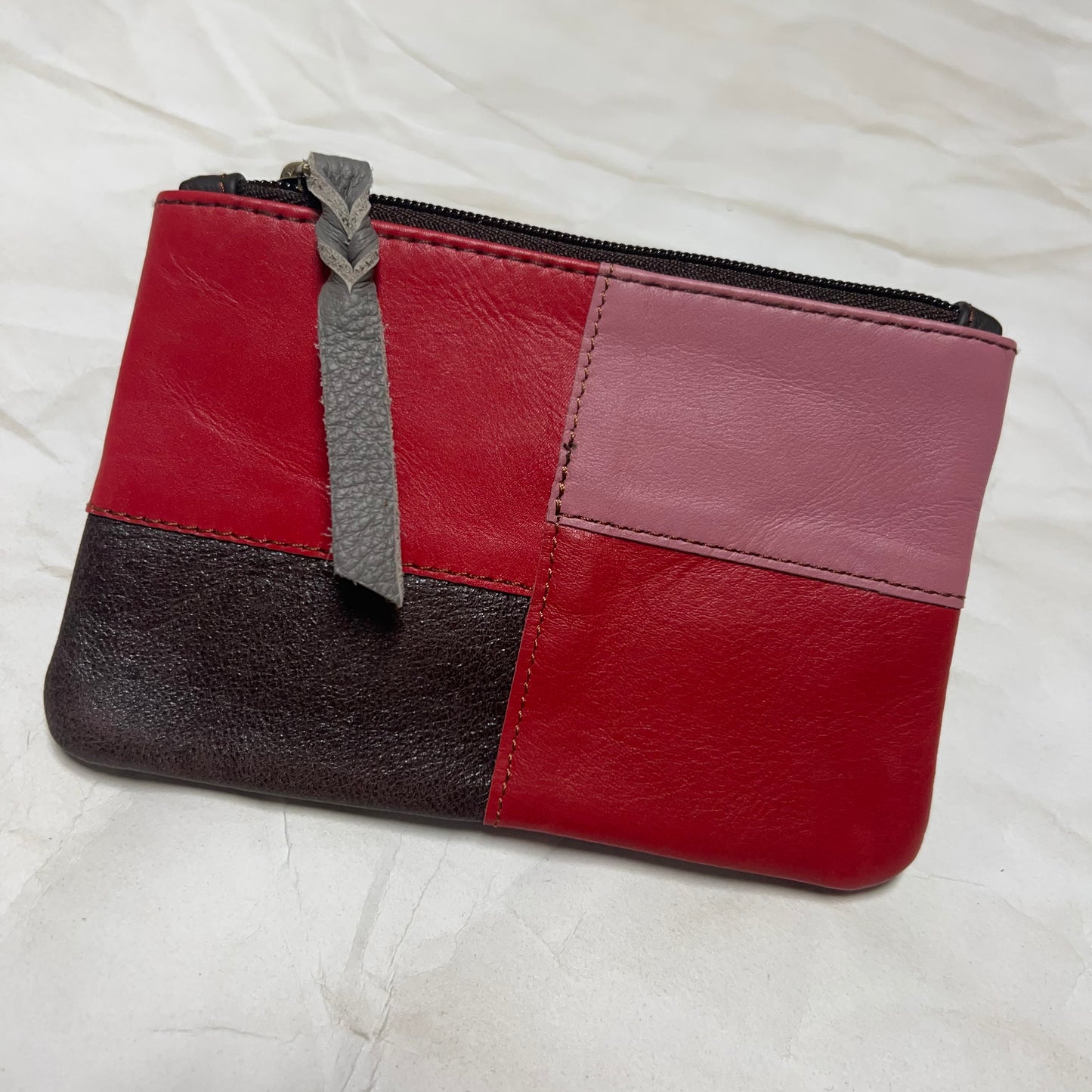zahra pouch with red and pink patchwork.