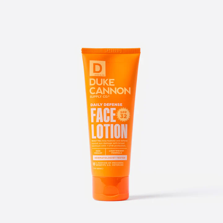 orange tube of Daily Defense Face Lotion printed with white and yellow text.