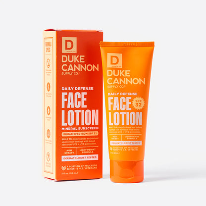 tube of Daily Defense Face Lotion set next to its box packaging.