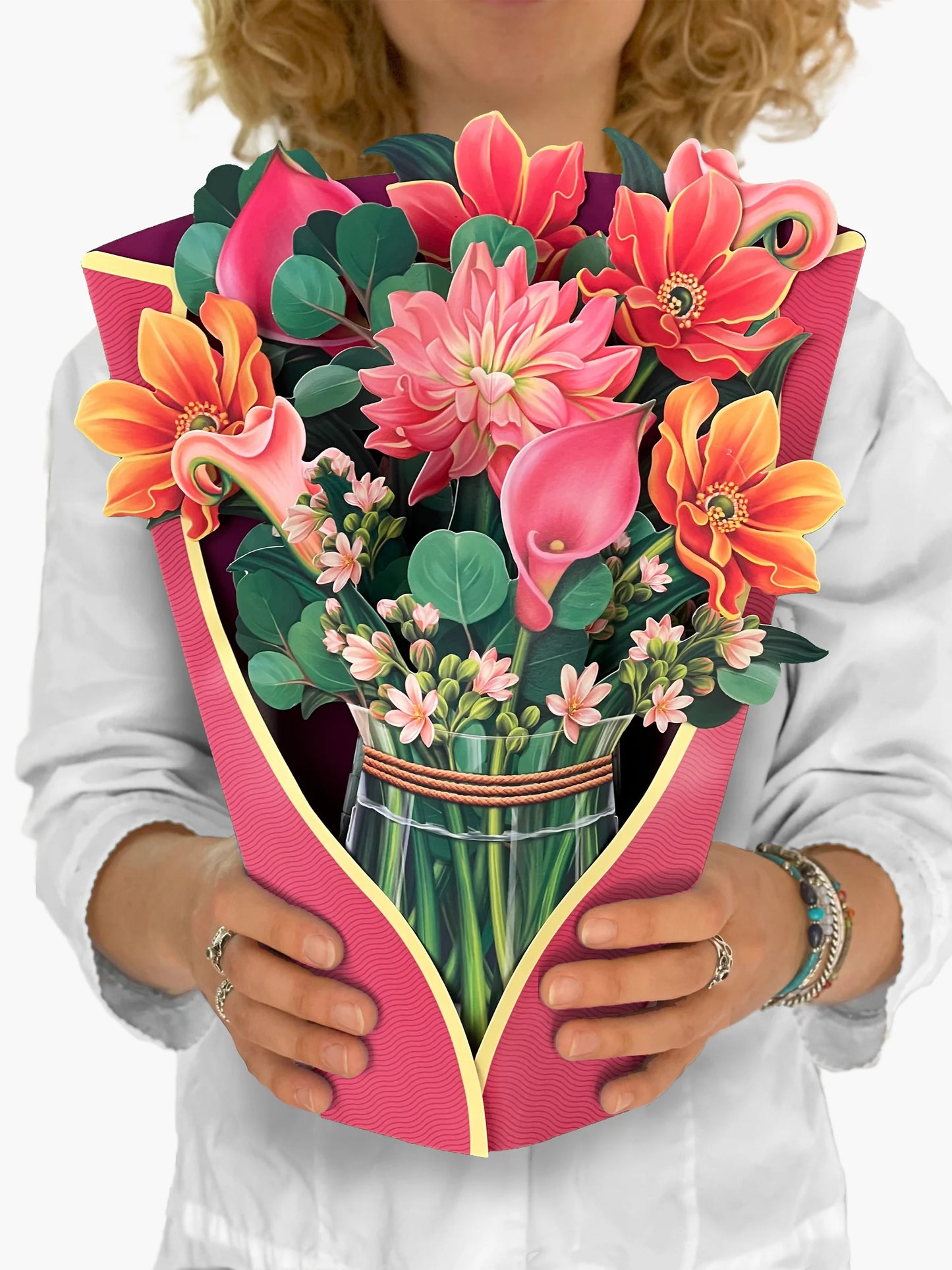 person holding dear dahlia paper bouquet in front of them.