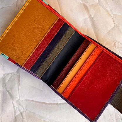 kelly wallet laying open showing multi-colored card slots.