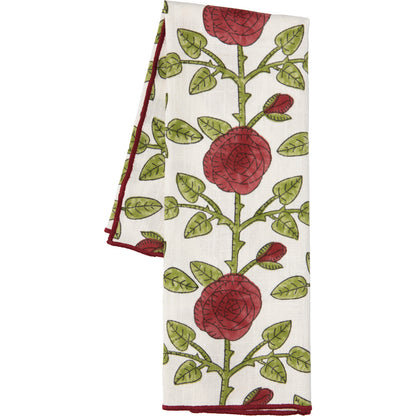 off-white towel with vining pattern of rod roses and green branches and leaves