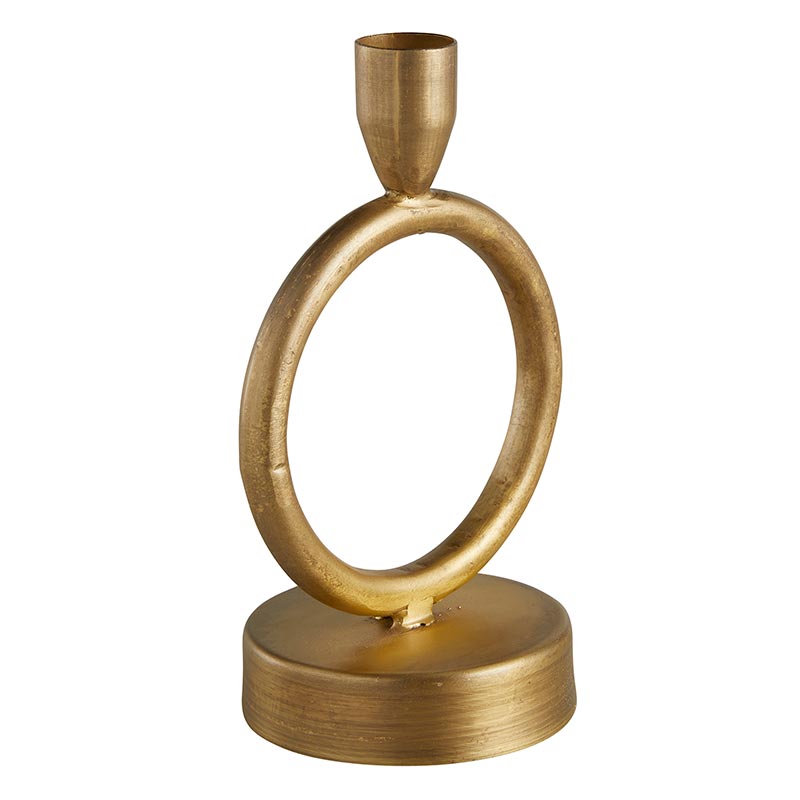 angled view of brass finished candleholder on a white background.