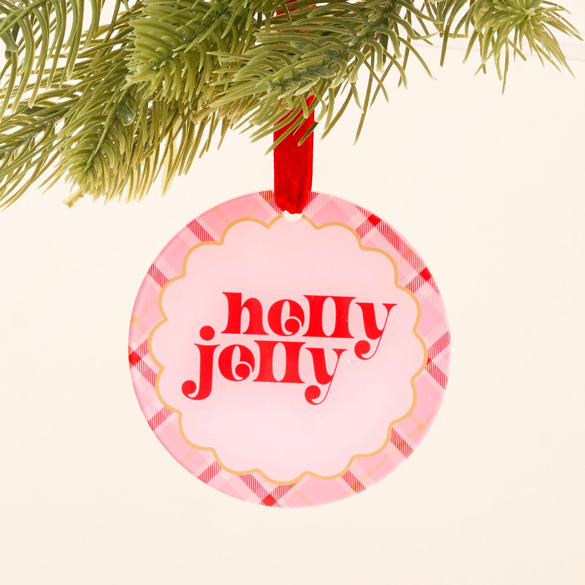 "holly jolly" round Christmas ornament with pink plaid boarder