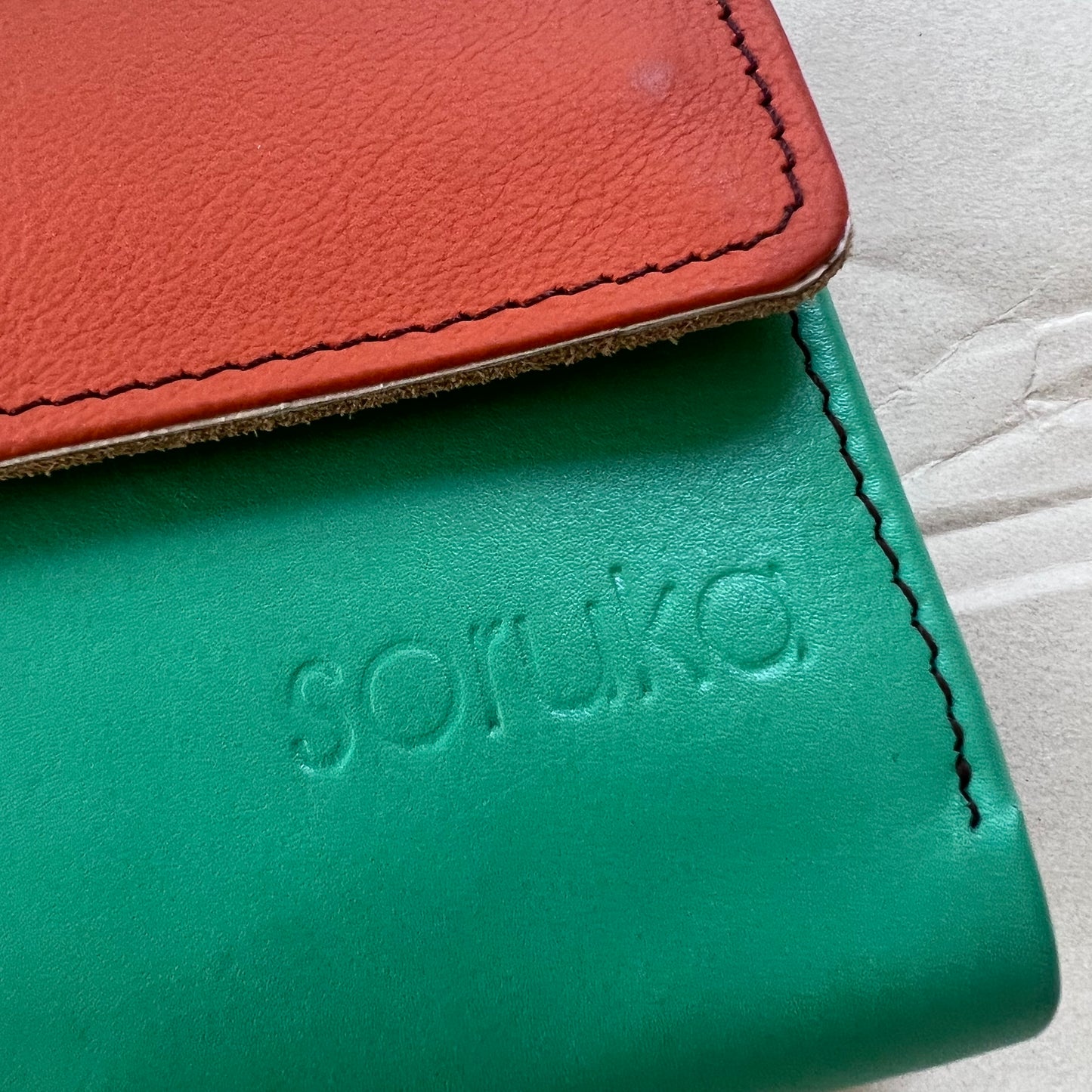 close-up of seafoam rings wallet