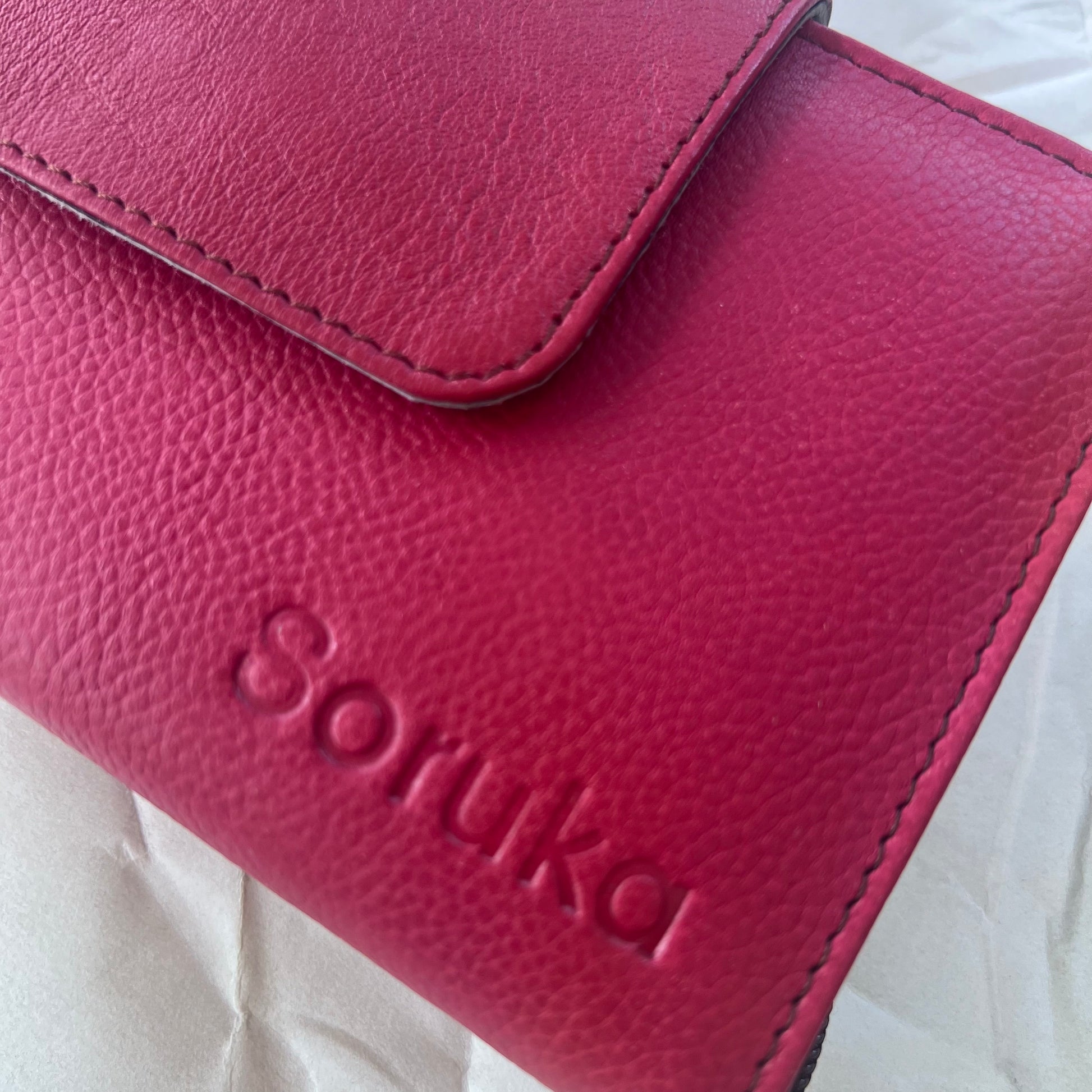 close-up of red Beatrice Clutch