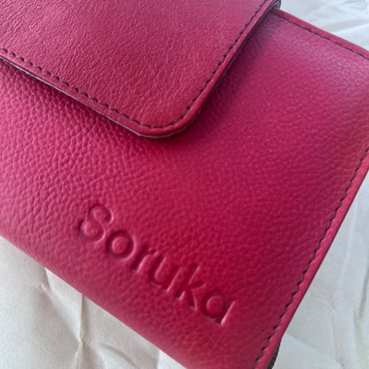 close-up of red Beatrice Clutch