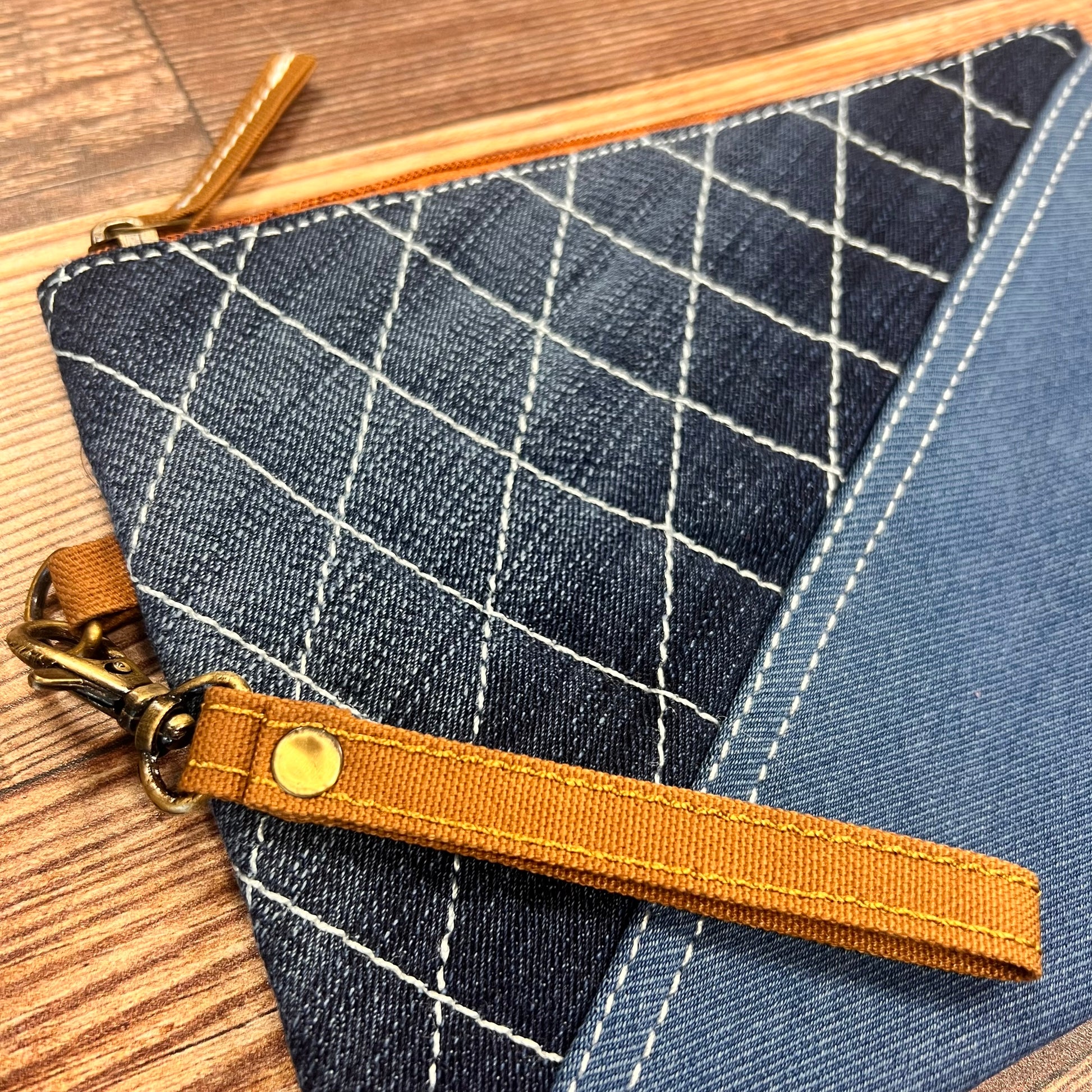 close-up of Denim Diagonal Wristlet Pouch.