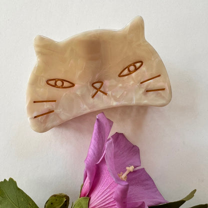 cream colored cat face hair clip.