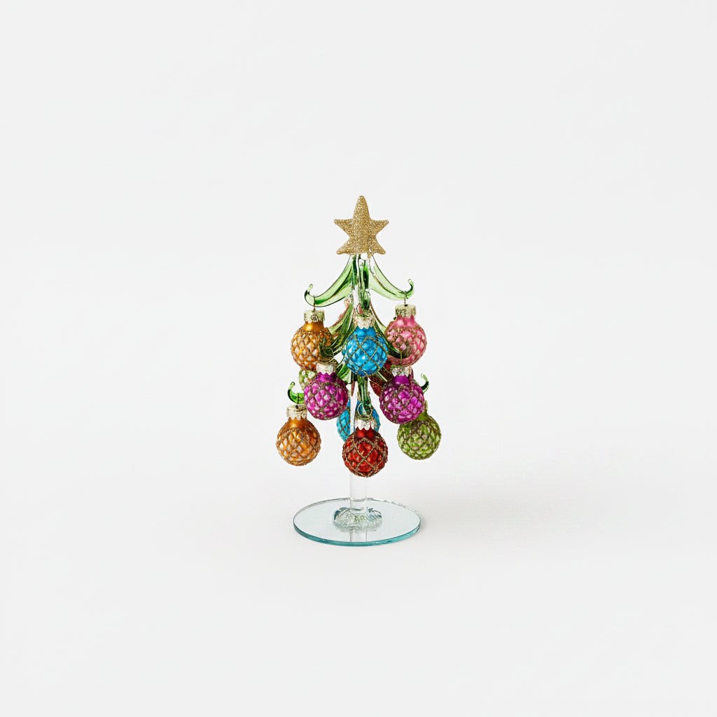 glass Christmas tree with colorful balls ornaments with diamond glitter pattern on them and gold star topper on it