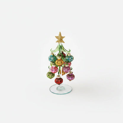 glass Christmas tree with colorful teardrop shape ornaments with striped glitter pattern on them and gold star topper on it